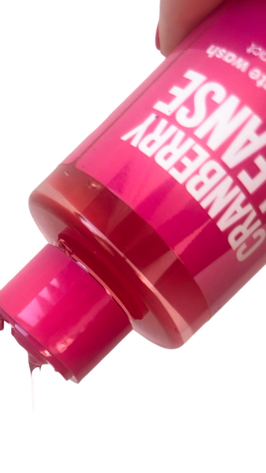 Bottle of cranberry cleanse close up of pink liquid
