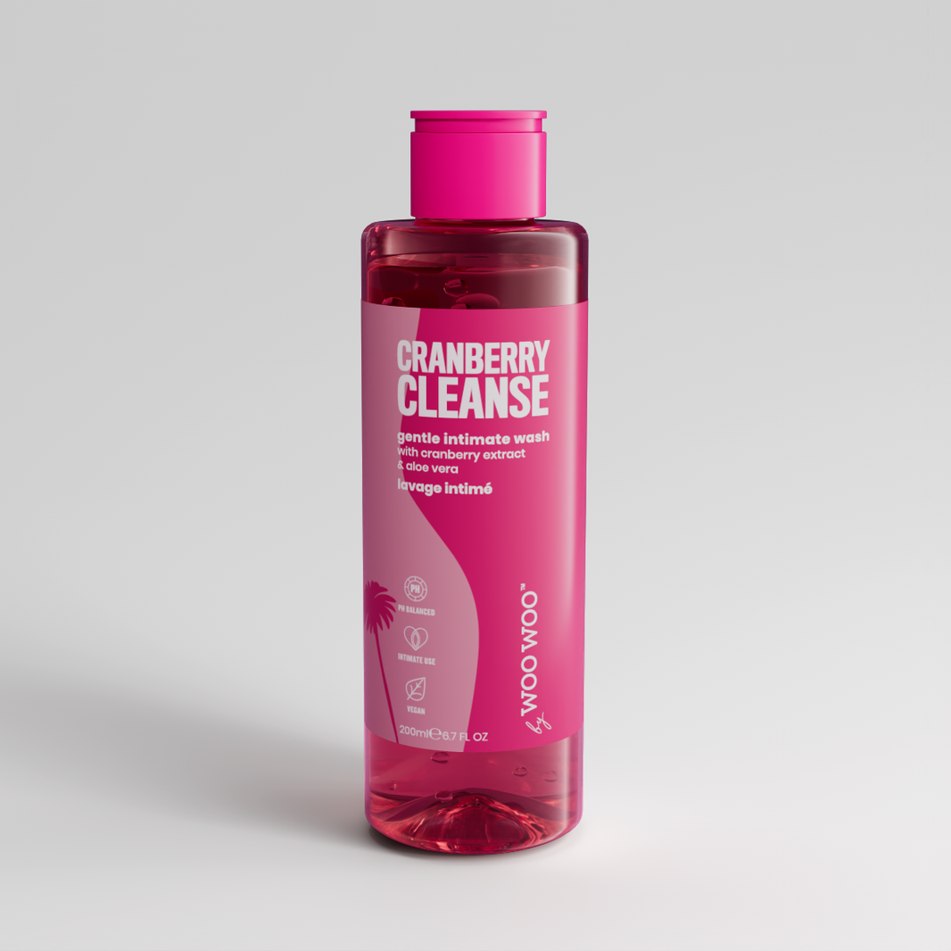 Pink bottle of Cranberry Cleanse on a light gray background
