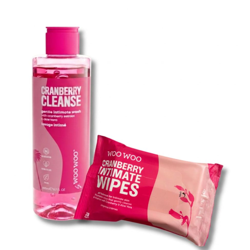 A bottle of Woo Woo Cranberry Cleanse liquid and a packet of Woo Woo Cranberry Intimate Wipes on a plain white background.